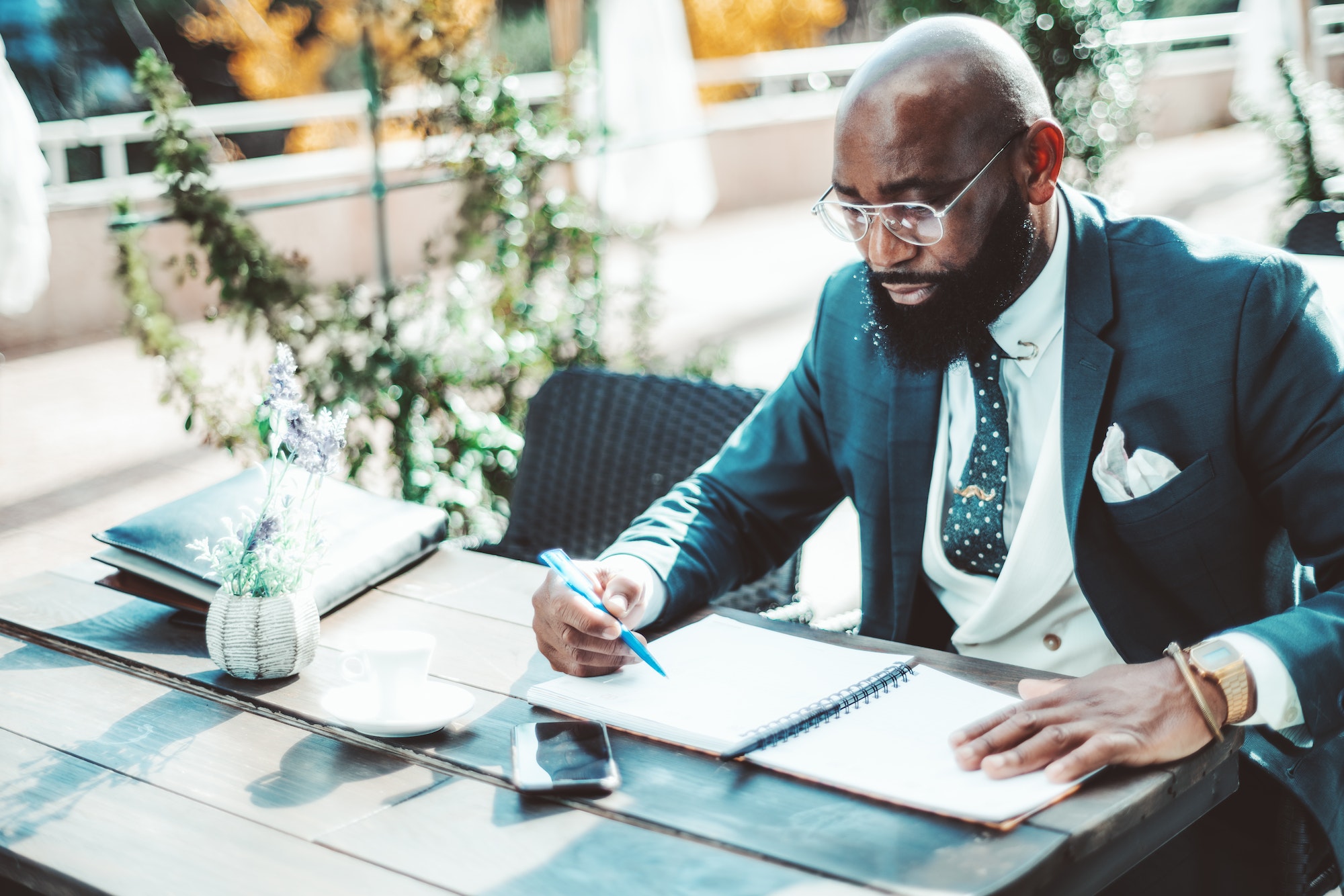 African refined male at a cafe