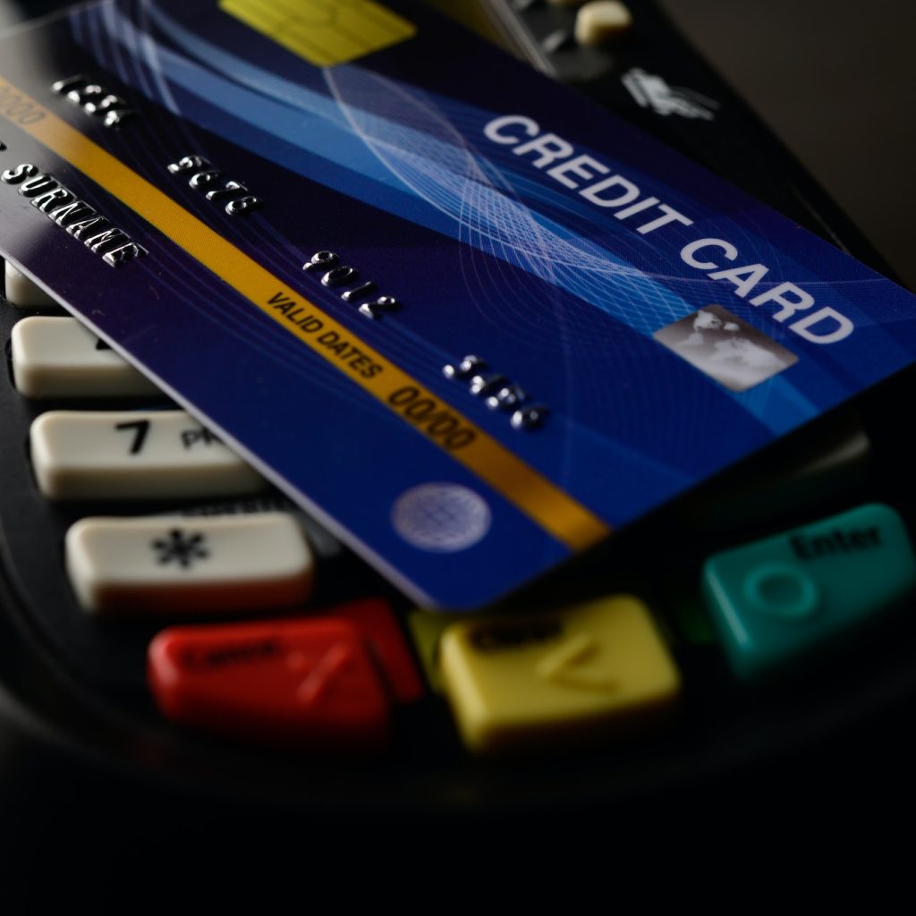 Credit cards placed on credit card swipes