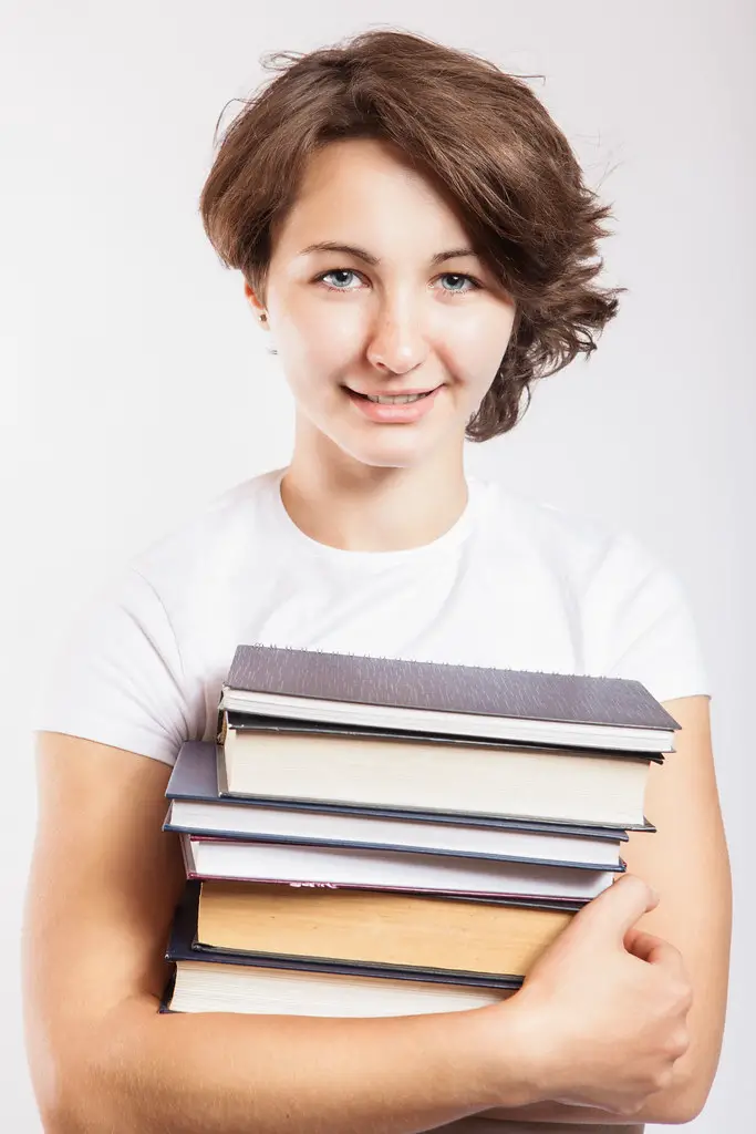 Female student holding library books