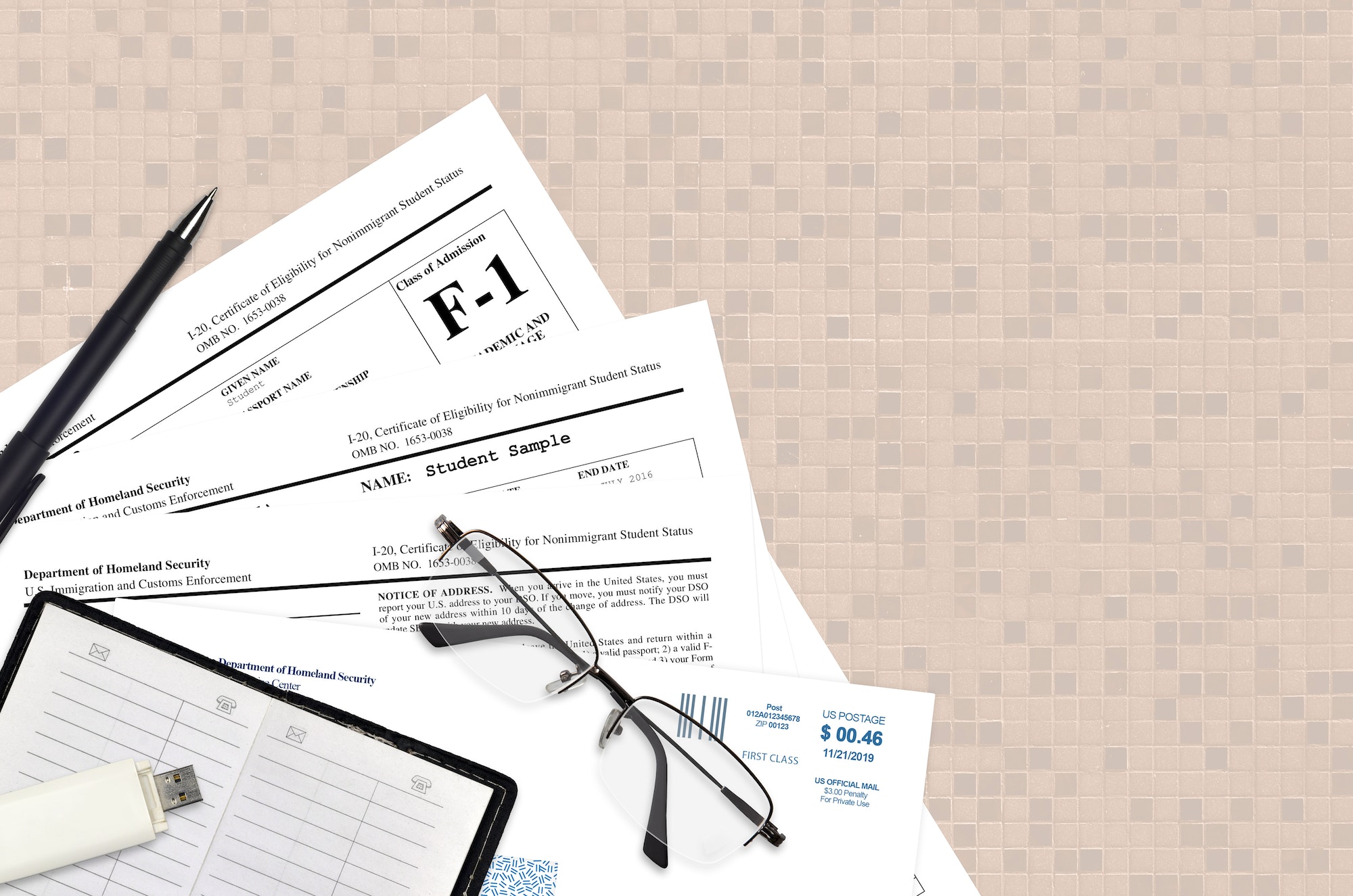 USCIS form I-20 Certificate of eligibility for nonimmigrant student status lies on flat lay office