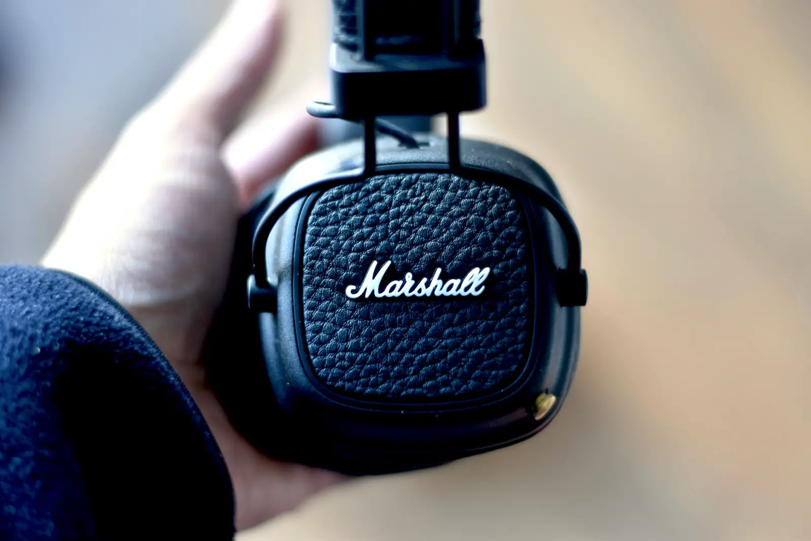 student wearing black Marshall discounted headphones