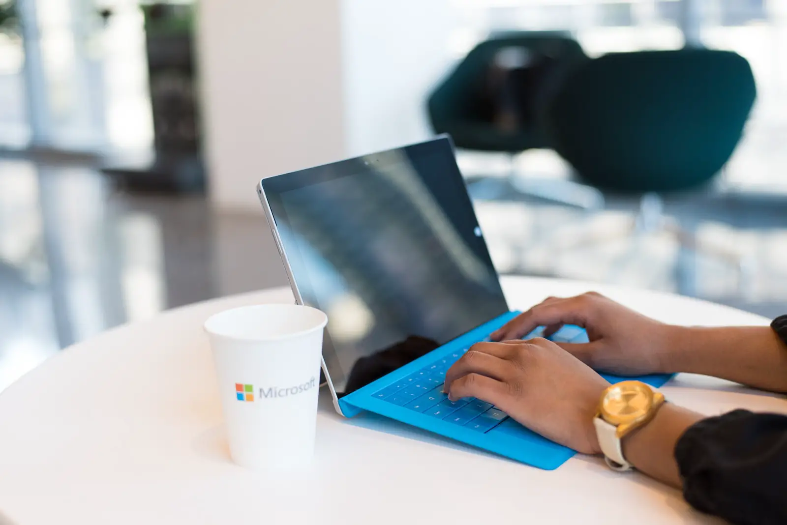 student using blue Microsoft Surface