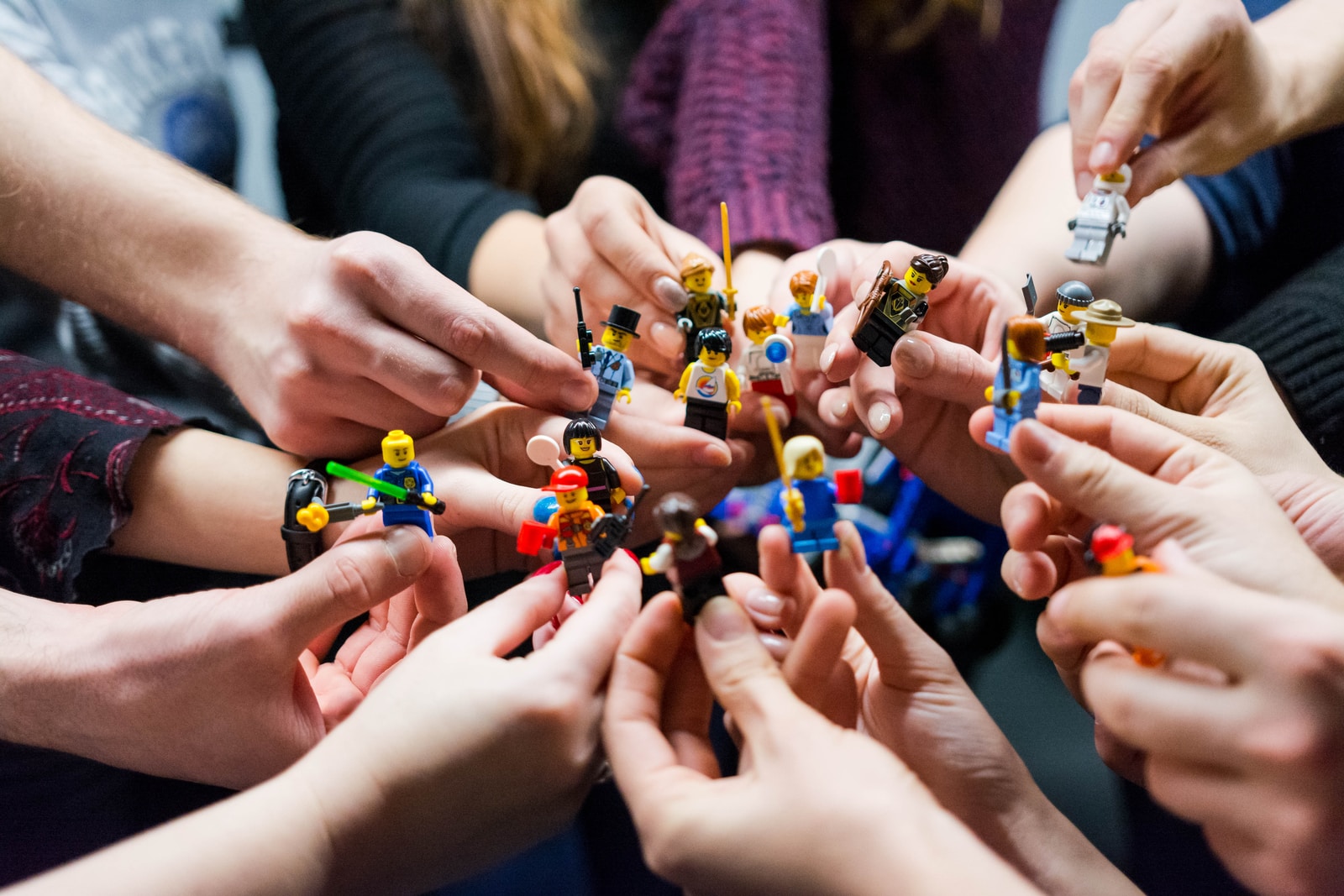 students holding miniature figures