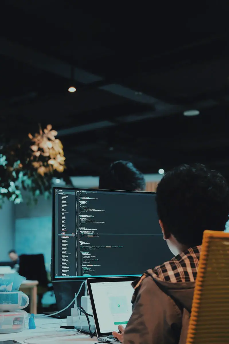 student in front of computer monitor