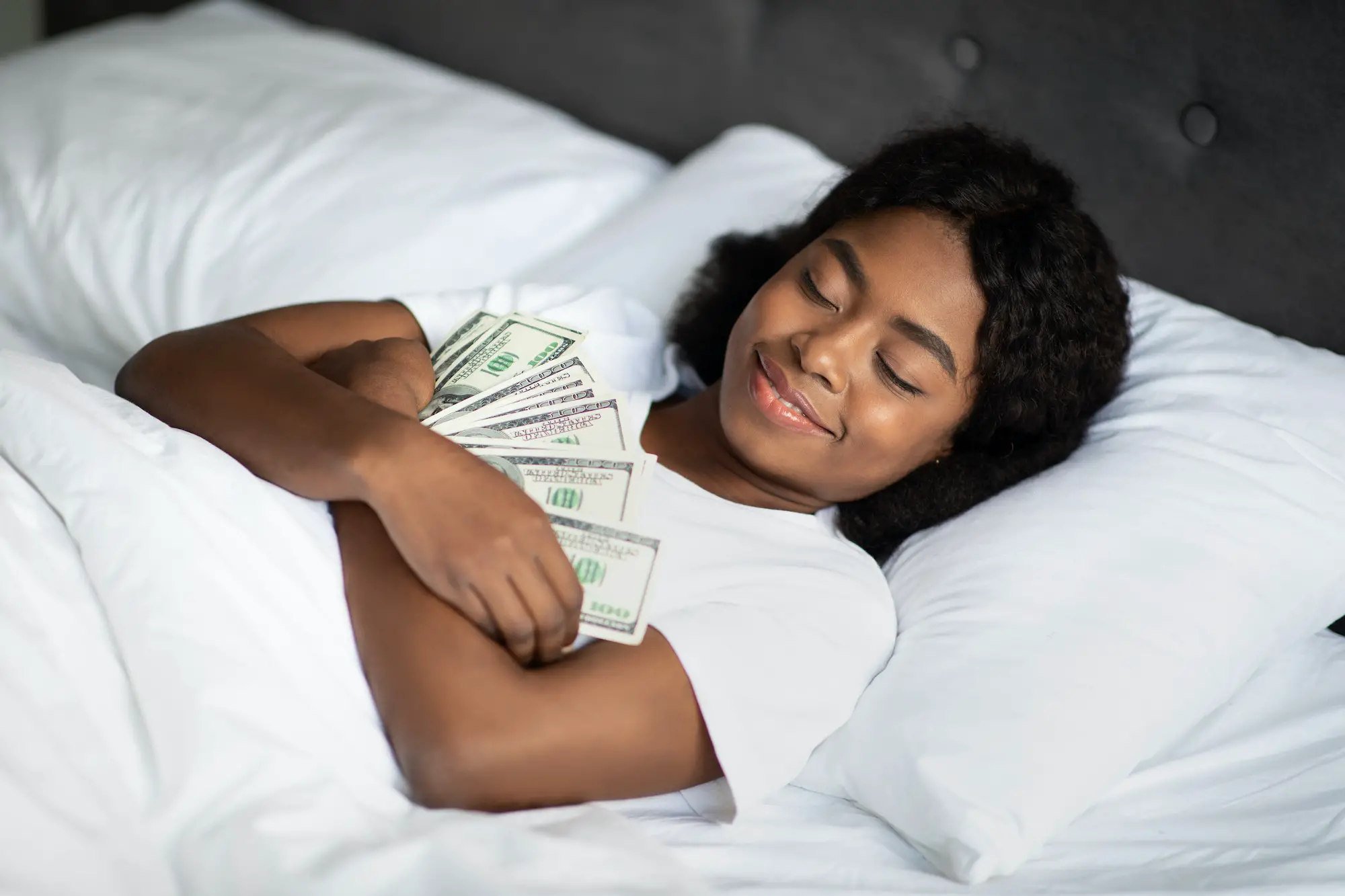Black woman sleeping with lots of cash