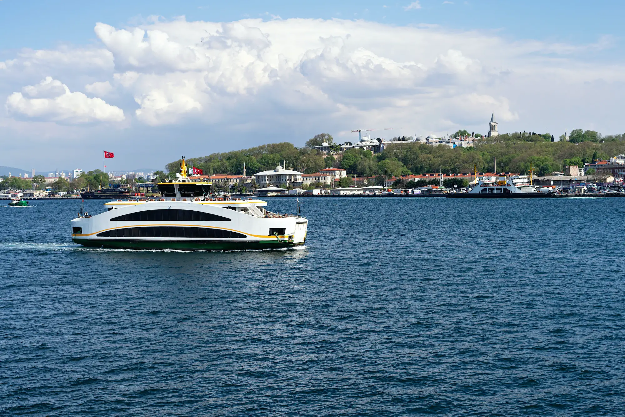 Ferry in Bosphorus in Istanbul city view. Sea transportation and passenger ferry sailing